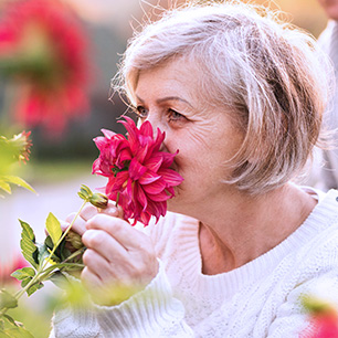 patient smelling a flower